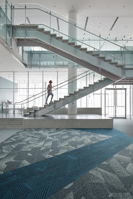 Spandrel™ and Play the Angle™, from the Rising Signs™ collection, work in unison to create visual movement, taking cues from the movement of the stairs to add additional geometry to the space. Artfully pairing texture with a bold accent color, these styles create a balanced yet dynamic design that give direction and flow to the space.