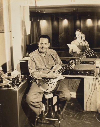 Les Paul with the 'Number One Les Paul', with Mary Ford circa 1952 in Paul's studio in Mahwah, NJ