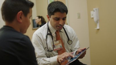 Dr. Rajan Merchant, an Allergy, Asthma, and Clinical Immunology specialist with Woodland Clinic Medical Group/Dignity Health Medical Foundation, with a patient.
