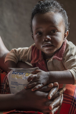 Image of a child eating SuperCereal Plus. Photo courtesy of World Food Programme.