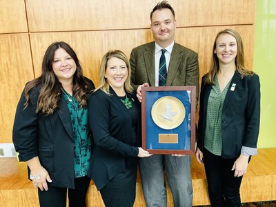 From Left to right: Sara O’Malley, Colleen Gilger, Eric Meyer and Jenna Goehring accepting the IEDC Organization of the year award.