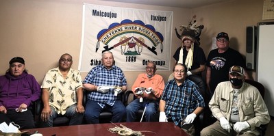 Lakota Elders, all with a family connection to Spotted Elk, accepting the Chief’s pistol and knife.