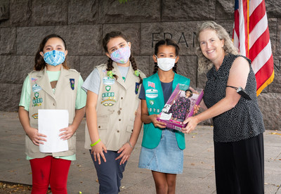 Mary Dolan, Co-Founder and Executive Director of the FDR Memorial Legacy Committee presents Girl Scout Troop 4720 with the Eleanor Roosevelt Barbie, donated by Mattel, from Mattel's Inspiring Women™ series that pays tribute to incredible heroines of their time.
