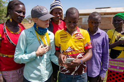 Sarah Evans, the founder of Well Aware and CEO & co-founder of Well Beyond, with Alamach villagers