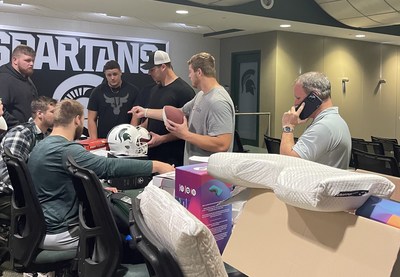 The Michigan State Offensive Line being fit for Pillows by Dennis Gartland President of TrueSleep Mattress Store. Heisman Trophy front runner, Kenneth Walker III. Kenneth Walker III also started sleeping on a custom fit Posh+Lavish latex mattress designed to aid in rest and recovery. It may be a coincidence but shortly after Walker and the O-line changed their sleep systems Walker broke the school record for longest play from scrimmage.TrueSleep has location in throughout Michigan and in Aurora