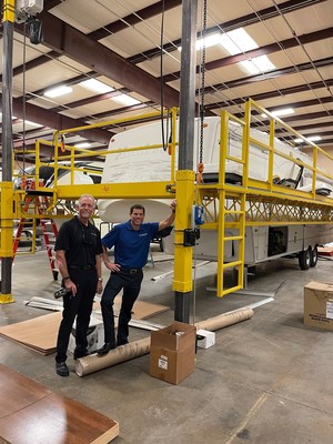 Chris Glenn (Vice President of Service and Parts Operations) and Jon Ferrando (President and CEO) standby the only fully functioning 360 hydraulic lift at the Aloha RV dealership that has 18 service bays.