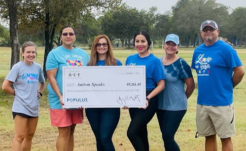 ACE Cash Express associates present a $9,261 donation to Lauren Brooke, Senior Field Development Coordinator and Betti Guzman, Senior Regional Director at Autism Speaks