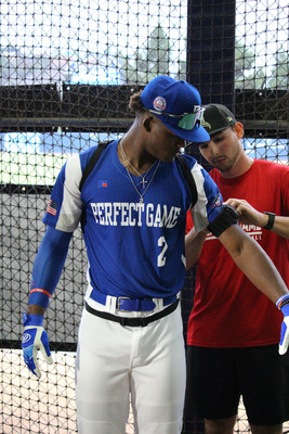 Elijah Green, the No. 1 ranked prospect in the 2022 high school class, gets fitted with motion capture monitors by a PG Tech biomechanics specialist, prior to stepping into the innovative, high-tech batting cage.