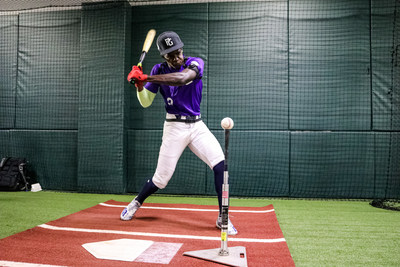 Perfect Game All-American, RJ Austin, swings at a ball in the PG Tech batting cage. The innovative, data-capturing, performance enhancement system will be made available to more than 10,000 amateur baseball players in 2022.