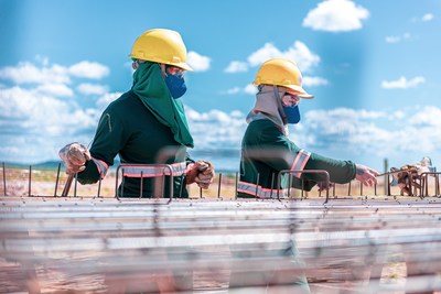 Employees at an Atlas solar farm in Latin America