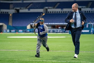 Rich Eisen warms up with St. Jude Children's Research Hospital patient Von prior to the 2020 Run Rich Run event. Eisen was presented with the St. Jude Ambassador of the Year award for his dedication and support of the St. Jude. Image take prior to Covid-19 restrictions.