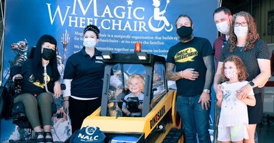 (L to R) Christine Getman, Magic Wheelchair; Jenny McGahan, Muscular Dystrophy Association; MDA family member, Mason in his new ‘Dinosaur’ front loader wheelchair costume; Scottie Foertmeyer, Magic Wheelchair; MDA family of Mason, at the IAFF Missoula City Fire Fighters Local 271 Station 5 costume reveal for 2020 competition winner, in Missoula, Montana.