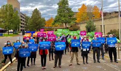 Providence St. Vincent caregivers and donors attending the renaming event hold signs expressing their gratitude to the Knights.