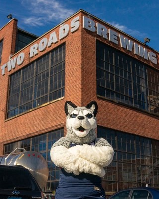UConn Husky mascot visits Two Roads Brewing in Stratford, Conn.