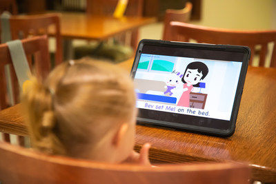 Toddler watching a read-along video from the First Step Phonics short E series