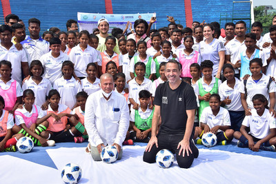 Mr. Youri Djorkaeff, CEO - FIFA Foundation and Dr. Achyuta Samanta, Founder, KIIT & KISS amidst the football trainees during the lunch of FIFA Football for School Programme at KISS