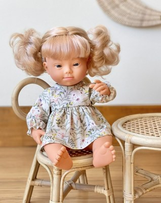 The Miniland Ruby Doll with Down Syndrome is a 15" baby doll with Strawberry Blonde hair that features the sweet facial characteristics of babies with Down syndrome in a realistic and respectful way.