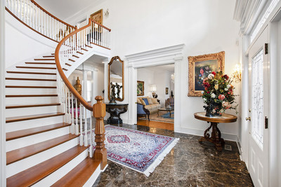 The grand foyer with winding staircase provides an elegant entry to the owner’s estate. Interiors are classical and elegant in design, but are easily adaptable to a more modern style, if desired. NorthCarolinaLuxuryAuction.com.
