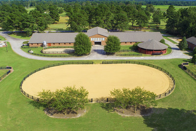 The impressive main barn features 66 horse stalls (plus 6 additional wash and grooming stalls) on its lower level, in addition to a large office and showroom. The upper level of the barn includes spacious, 3-bedroom and 1-bedroom apartments, along with a large entertainment lounge, kitchen and glass-enclosed DJ booth with professional A/V equipment. Just outside the main barn is a regulation-sized riding arena, the largest of 4 arenas located on-site. NorthCarolinaLuxuryAuction.com.