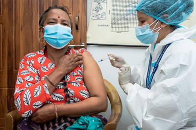 In central Nepal, 53-year-old Bijuli Devi Tamang receives a COVID-19 vaccine donated through the COVAX Facility (CNW Group/UNICEF Canada)