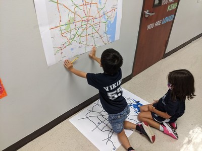 Pictured here are two second grade students from The Village School in Houston who are participating in National STEAM Day in partnership with MIT. As part of MIT’s Extreme Weather challenge to students, they created a project in which they used robots to find the safest routes around flooded streets.