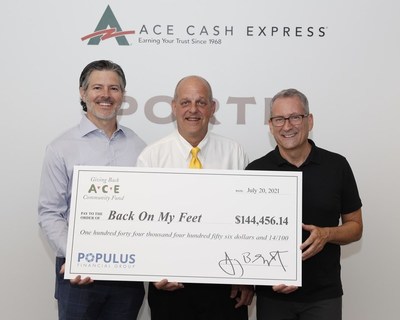 RB Ramsey, Executive Vice President, General Counsel & Chief Compliance Officer of Populus Financial Group presents a $144,456 donation to Gerald Belkofer, Alumni and Bill Turner, Member Services Coordinator at the Dallas/ Fort Worth Back on My Feet chapter