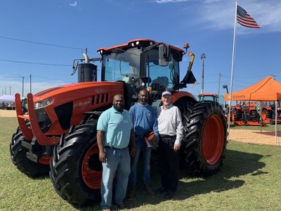 U.S. Marine Corps veteran Tracy Robinson (middle) received a free one-year lease of a Kubota M8 Series tractor through Kubota’s Geared to Give program in partnership with the Farmer Veteran Coalition during a special ceremony at the Sunbelt Ag Expo in Moultrie, Georgia, last month.