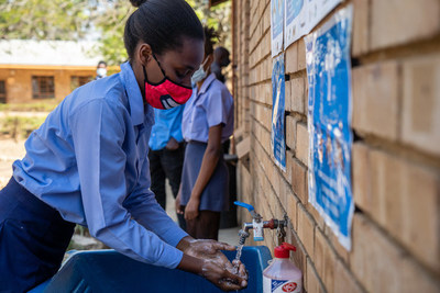Children use outdoor handwashing facilities at Ramauba Secondary School in South Africa. Credit: WaterAid/Eben Liebenberg