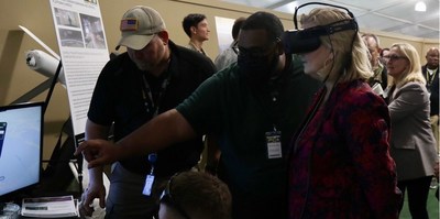 Army RCCTO partners brief the Secretary of the Army Christine Wormuth on Immersive Wisdom's 3D Remote Virtual Operations Center. Photo Source: Official Secretary of the Army Twitter Page: https://twitter.com/secarmy