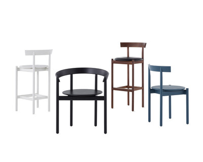 A collection of comma chairs in a variety of colors, finishes and sizes.