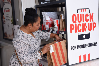 Guest skips the drive-thru line to pick up a meal at KFC’s new dedicated Quick Pick-Up shelf.