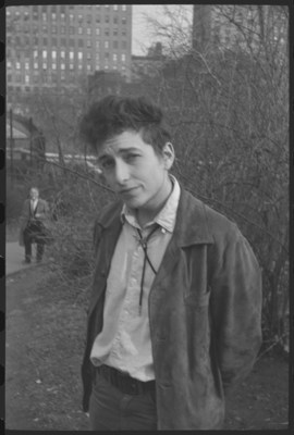 A never-before-seen image of Bob Dylan in Central Park, New York City, photographed by Gloria Stavers in 1963.