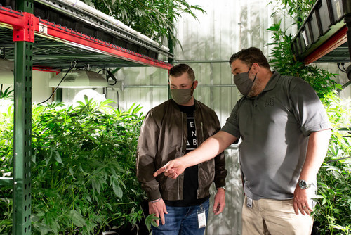 Item 9 Labs Corp. CEO Andrew Bowden (left) and VP of Cultivation Cory Carter (right) walk the Company's Arizona cultivation facility, where the company is more than doubling its operations space in the year ahead.