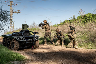 Elbit Systems' 6X6 ROOK UGV operating alongside soldiers. (PRNewsfoto/Elbit Systems)