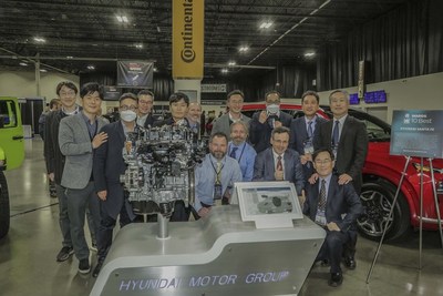 Alain Raposo, Head of Powertrain Tech Unit, and Woosuk Choi, Vice President at Electrification Development Center, pictured lower right with Hyundai Kia America Technical Center Inc. team after accepting award from Informa Tech Automotive Group during Automotive Tech Week at  Novi, Mich., on Monday, November 15, 2021.