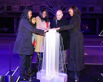 L to R: Jada Yelverton-Graves, Dreshta Bohria and Caitlin James from the Girls Opportunity Alliance community from Girls Inc., Marc Metrick, CEO of Saks and Michelle Obama, former First Lady of the United States and founder of the Girls Opportunity Alliance at the Saks Fifth Avenue Holiday Window Unveiling