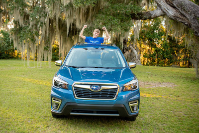 Make-A-Wish kid Colton poses inside a Subaru at Hadwin-White Subaru in Conway, S.C. (Credit: Hadwin-White Subaru)