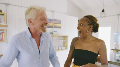 Sir Richard Branson surprises Omaze winner Keisha at her home in Antigua