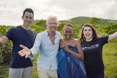 Omaze CEO and co-founder Matt Pohlson, Sir Richard Branson, Omaze winner Keisha, and Space For Humanity Executive Director Rachel Lyons congratulate Keisha at her home in Antigua