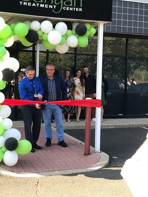 Banyan Employees, Michael Arcangeletti (Executive Director) and Eric Oakes (Chief Operating Officer) pictured at Eating Disorder Program Open House cutting the ribbon to symbolize we are open for business.