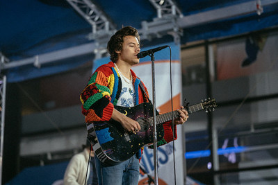 Singer wearing the JW Anderson Colourblock Patchwork Cardigan which became a social media trending sensation