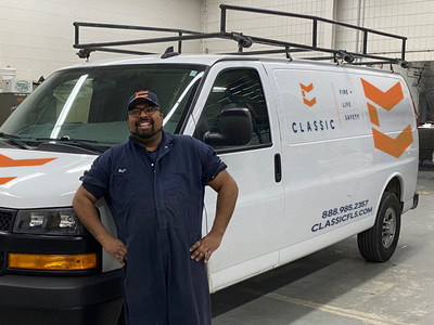 Fleet mechanic Nazir Lakhani proudly showcases the new Classic Fire + Life Safety branding on a freshly-serviced company van. Nazir and his team will oversee the installation of the new logo onto the company's fleet of 300 + vehicles ? part of a company-wide rebranding to be completed by March 2022. (CNW Group/Classic Fire + Life Safety Inc.)