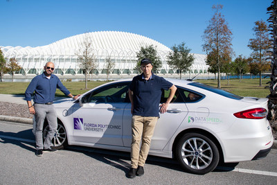 Florida Polytechnic University researchers Dr. AJ Alnaser (left) and Dr. Onur Toker stand alongside the new drive-by-wire autonomous test vehicle on campus in Lakeland, Florida.