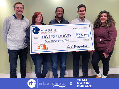 RHP Properties employees Preston McNab, Jennifer Kucharski, Christopher Williams, Jose Cejudo and Leah Rodriguez present a $10,000 check to No Kid Hungry.