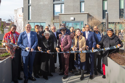 Omni New York, elected officials, and community stakeholders celebrate the completion of Archer Green in Jamaica, Queens. Image courtesy of Dominique Sindayiganza and Omni New York.