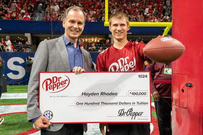 Hayden R., winner of the Dr Pepper Tuition Toss during halftime at the 2021 SEC Championship Game on December 4, 2021 at Mercedes-Benz Stadium in Atlanta, GA, accepting the award. CREDIT: AP IMAGES FOR DR PEPPER