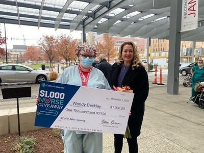 Ohio Nurses Association Member, Wendy B. receives her $1,000 from California Casualty Field Marketing Manager, Ashley Sprankle