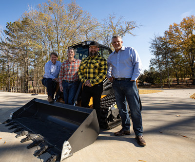 Camp Southern Grounds CEO Mike Dobbs, CNH Industrial CEO Scott Wine, Zac Brown and CASE Construction Equipment Vice President?North America Terry Dolan stand with the donated compact track loader.