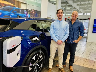 Herman Cook Volkswagen General Manager and co-owner Connor Cook and Stellar Solar CEO Kent Harle with the new VW ID.4 Electric Vehicle and Bosch Power Max EV Charger soon to be powered by the Stellar Solar 65kW solar system.