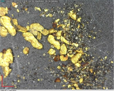 Image 2: Photograph of Placer Gold Down-Drainage from Hole 21 & Surface Prospecting Area (CNW Group/Sitka Gold Corp.)